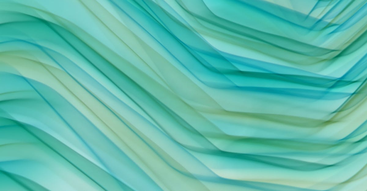 a green and blue abstract background with waves